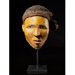 Tribal: Baskongo yellow polychromed face mask with organic head covering Kongo people, DRC 27cm