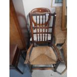 Early oak rush seated chair and Victorian balloon back chair