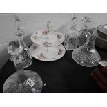 5 decanters and cake stand