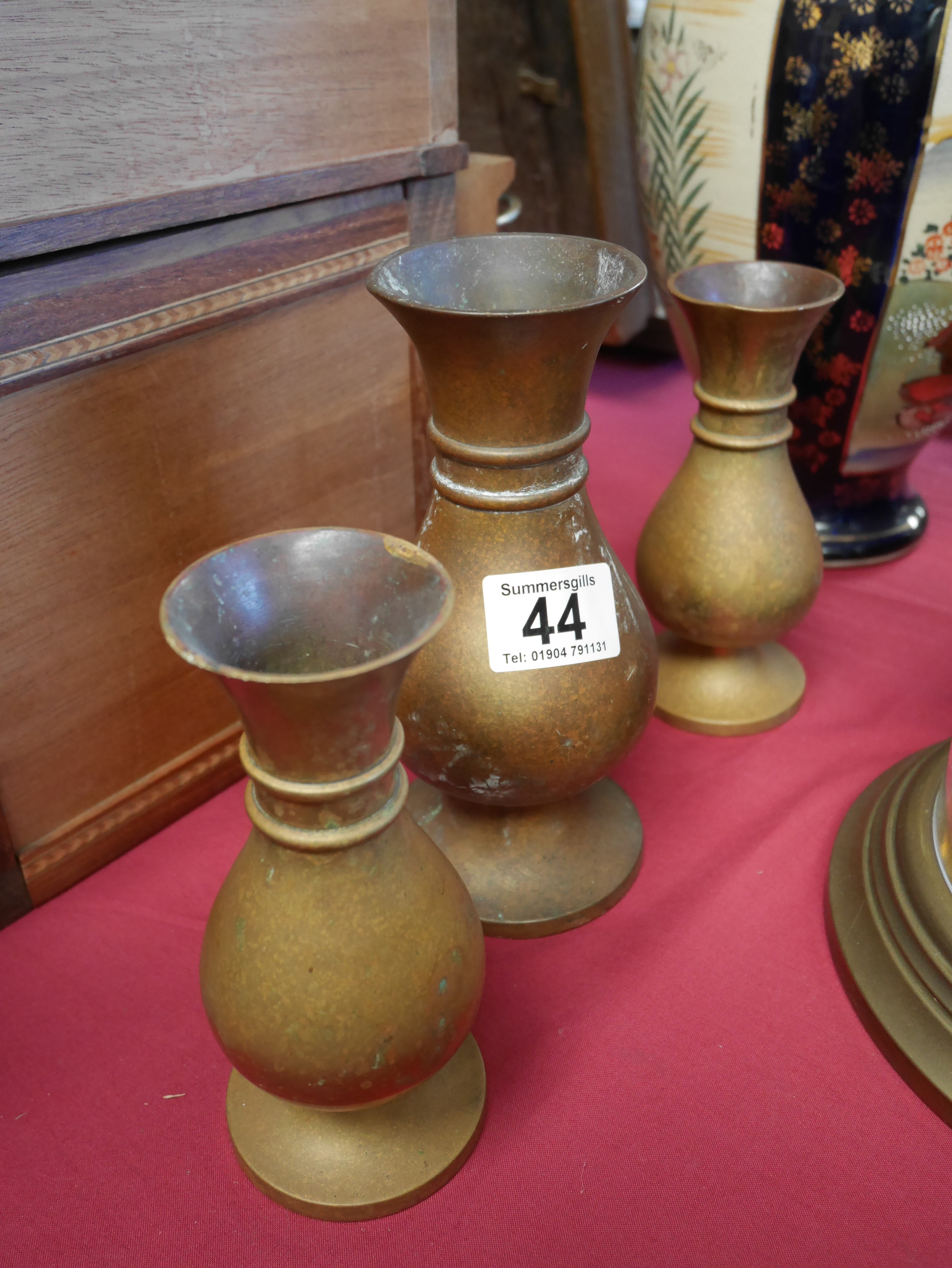 Trio of Victorian brass vases by Jones and Willis Church furnishers.