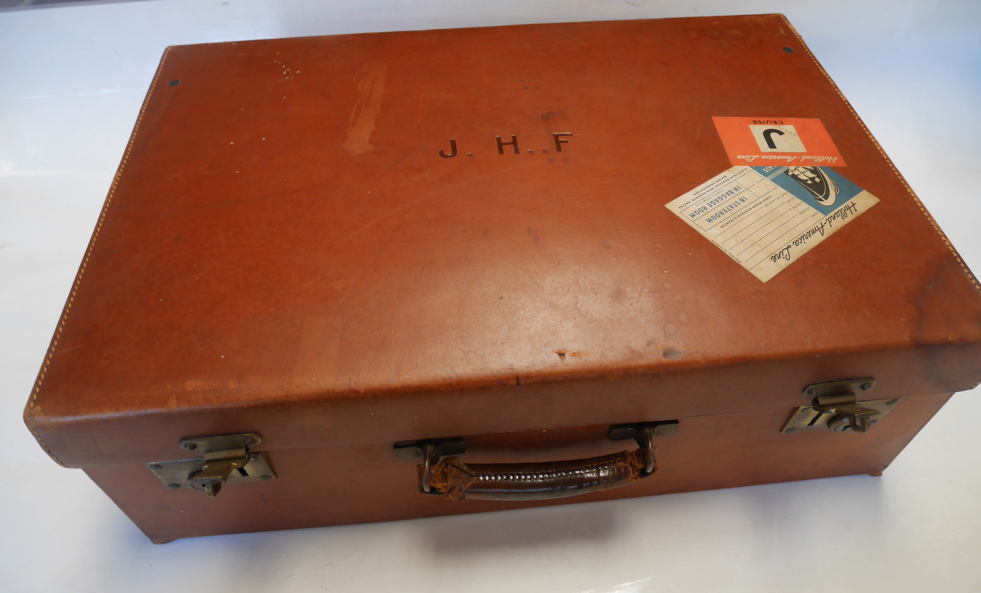 Leather suitcase by " Finnigans Bond Street London " with London silver bottles