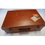 Leather suitcase by " Finnigans Bond Street London " with London silver bottles