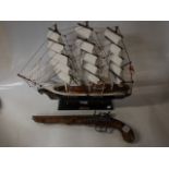 Cutty Sark Model and pistol
