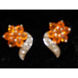 Pair of fire opal and diamond earrings set in silver