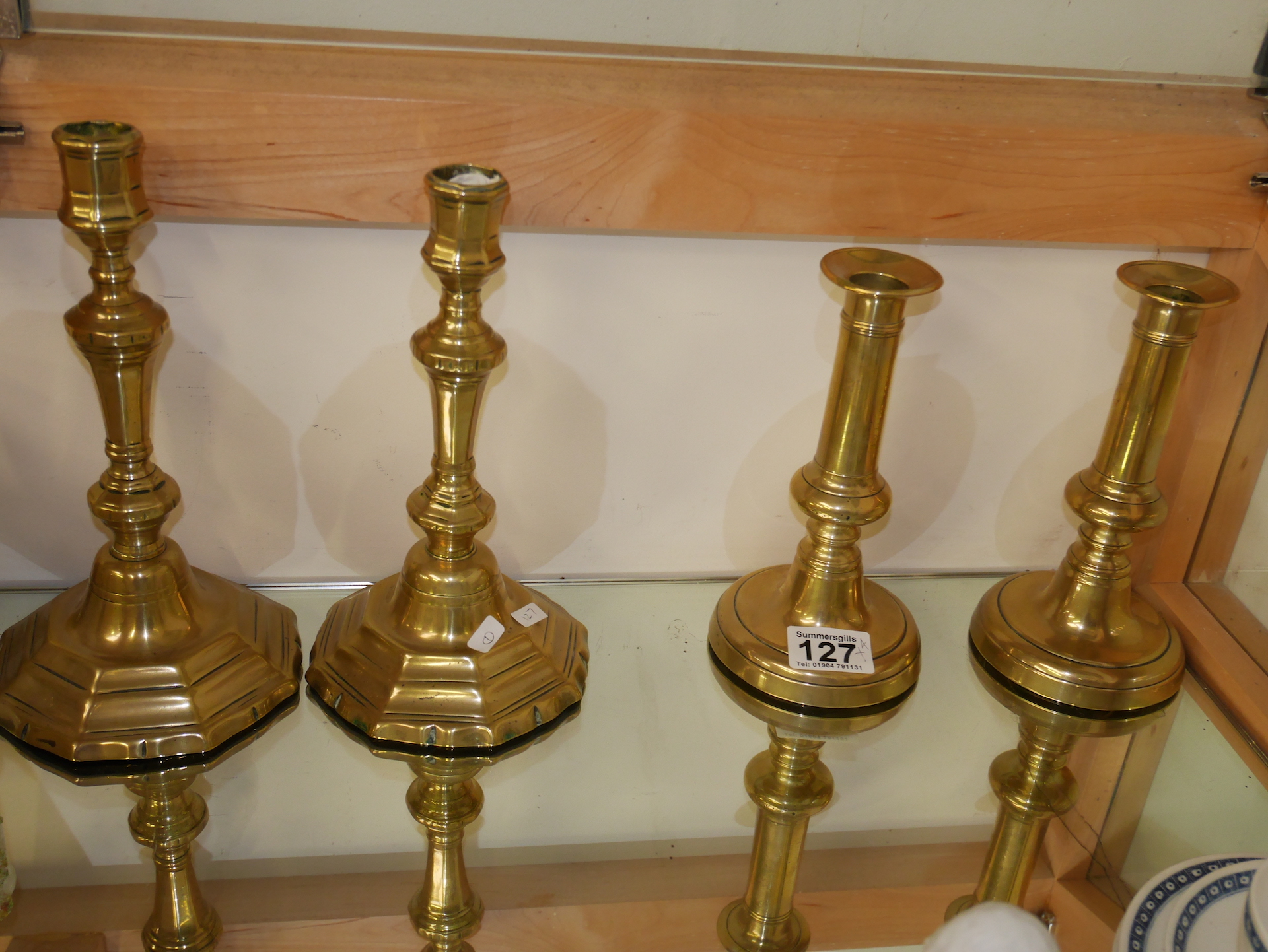 2 pairs of antique candlesticks