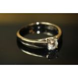 AN 18ct WHITE GOLD AND SOLITAIRE DIAMOND RING, having a single round cut diamond held in a
