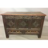 A 17TH CENTURY OAK MULE CHEST With carved lozenges and frieze, bearing initials 'MW, GW' above two