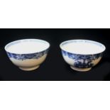 A FAIR PAIR OF QIANLONG BLUE AND WHITE ARMORIAL BOWLS Decorated beneath formal borders with the arms