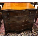 AN 18TH CENTURY STYLE MAHOGANY CHEST OF FOUR LONG DRAWERS, of serpentine form, with brushing slide