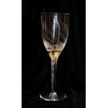 LALIQUE, A CRYSTAL GLASS CHAMPAGNE FLUTE The top of the stem depicted with the face of an angel