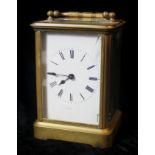 AN 20th CENTURY GILT BRASS CARRIAGE CLOCK, four glass panels and visual platform escapement aperture