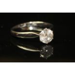 AN 18CT WHITE GOLD AND DIAMOND SOLITAIRE RING The single round cut diamond set in a claw clasp