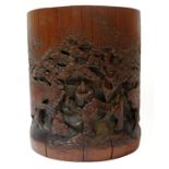 A 19TH CENTURY CARVED BAMBOO BRUSH POT, With attractive dark patination, deeply carved on one side