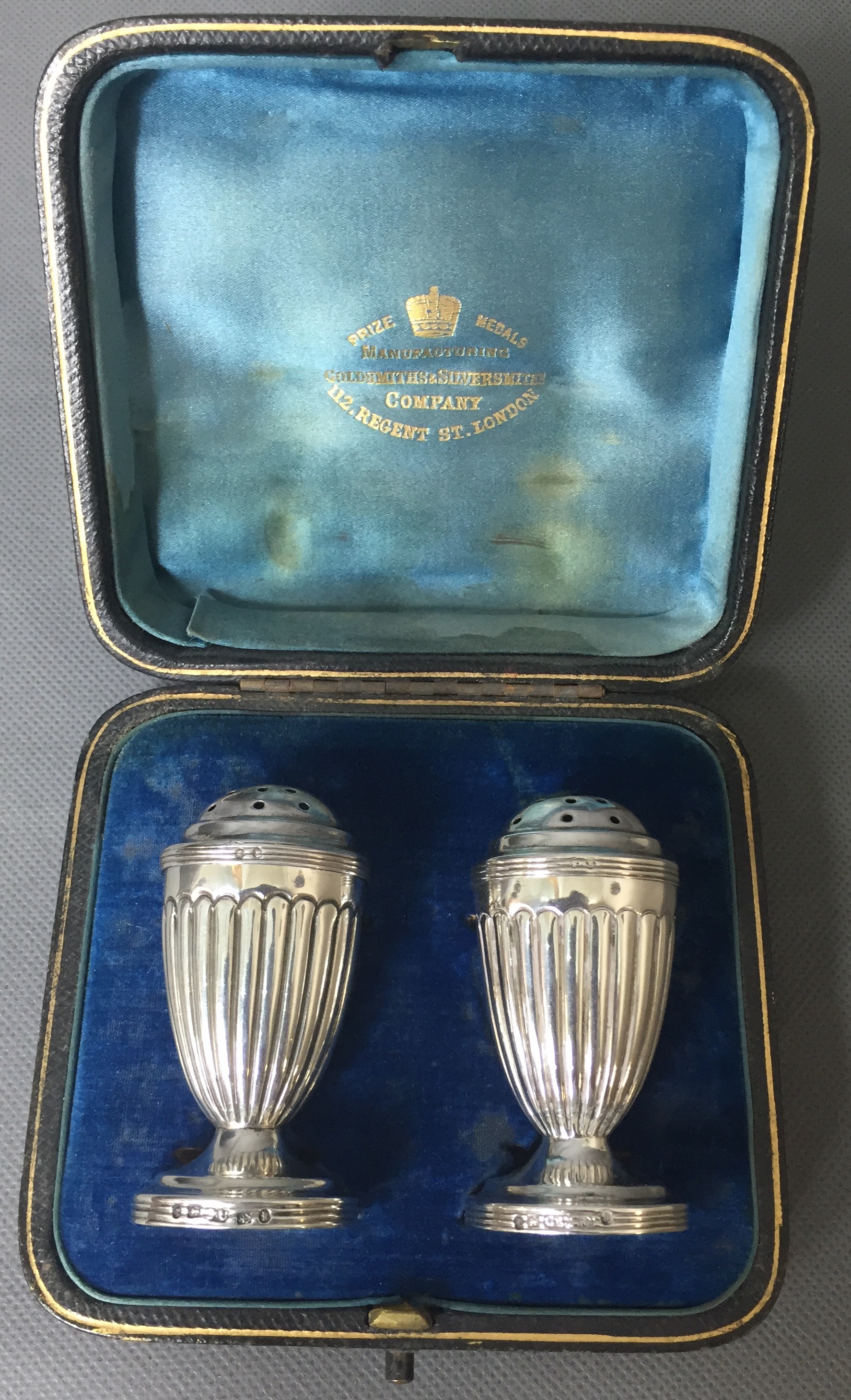 A PAIR OF VICTORIAN SILVER PEPPER POTS Of Neoclassical design with semi reeded body raised on - Image 2 of 2