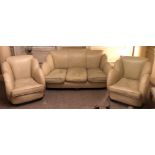 AN ART DECO PERIOD CLOUD BACK THREE PIECE SUITE, three seat settee , two arm chairs in cream leather