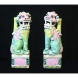 A PAIR OF CHINESE CHIEN LUNG PERIOD FAMILLE ROSE PORCELAIN KYLIN STATUES Hand painted in pink