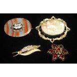 A COLLECTION OF VICTORIAN AND LATER BROOCHES. To include a shell cameo depicting the birth of