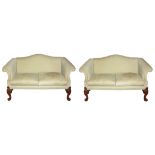 A PAIR OF EARLY 18TH CENTURY DESIGN TWO SEAT SETTEES, with humpbacks and scroll arms , raised on