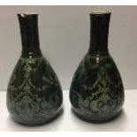 C.H. BRANHAM, A PAIR OF VICTORIAN POTTERY VASES Decorated with stylized birds amongst foliage,
