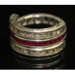 A VINTAGE RUBY AND SAPPHIRE 'FLIP' RING. Composed of a band channel-set with emerald-cut rubies