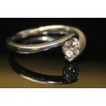 AN 18CT WHITE GOLD AND DIAMOND SOLITAIRE RING Having a single round cut diamond (Approximately. 0.