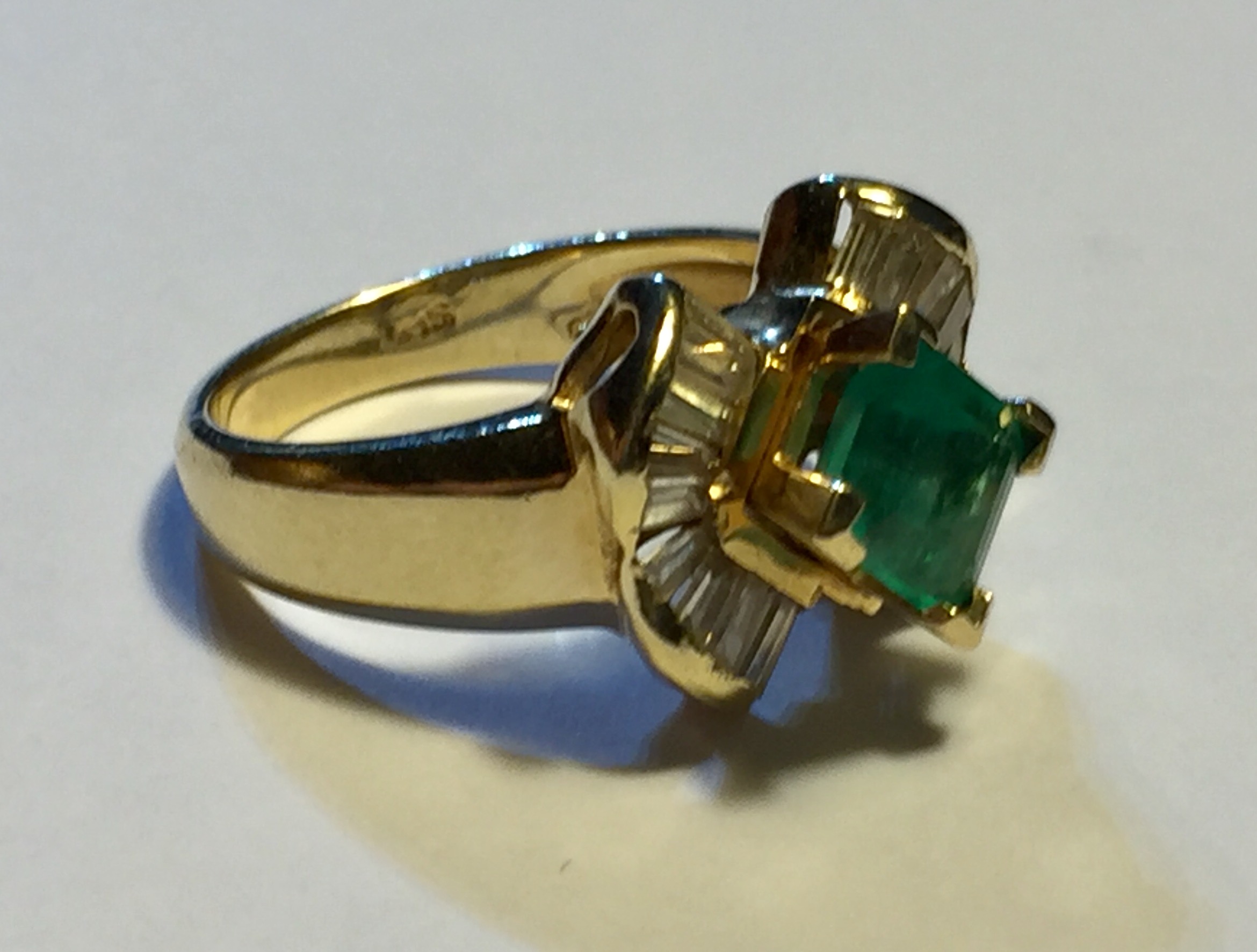 A 14CT GOLD, DIAMOND AND EMERALD RING Having a single cushion cut emerald flanked by baguette cut - Image 2 of 3