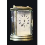 MALLET OF BATH,A 20th CENTURY GILT BRASS CYLINDRICAL CARRIAGE CLOCK, having four bevelled glass