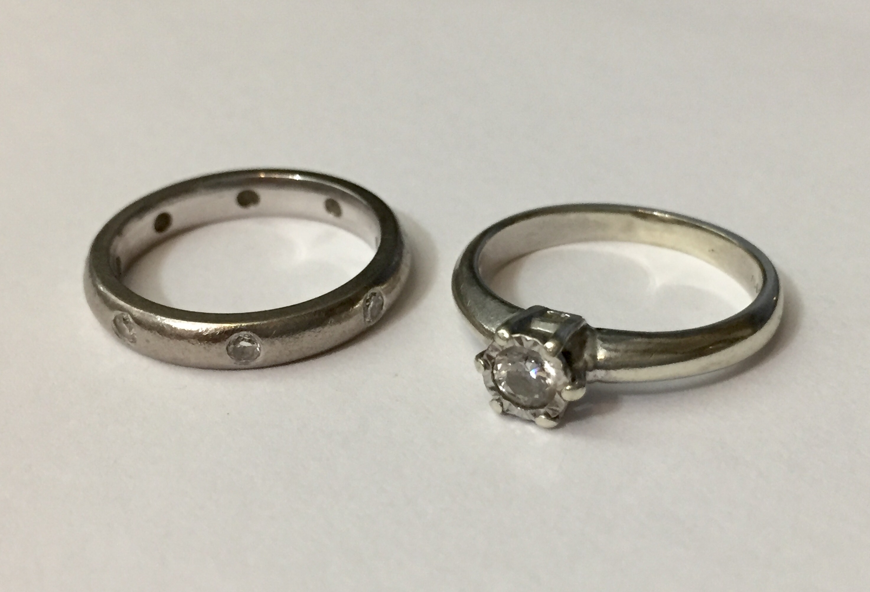 AN 18CT WHITE GOLD AND DIAMOND ETERNITY RING With eight round cut diamonds (size J), sold together