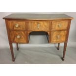 A REGENCY DESIGN MAHOGANY BOW FRONTED SIDE CABINET With green tooled leather writing surface above