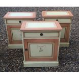 THREE CONTINENTAL BEDSIDE CABINETS with single drawer above cupboard painted with swags on a peach