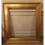 A LATE 19TH/EARLY 20TH CENTURY WATER GILT PICTURE FRAME 103 x 113 cm