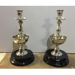 AN UNUSUAL PAIR OF 20TH CENTURY SILVER PLATED BALUSTER CANDLESTICKS WITH CIGAR HOLDER SECTIONS