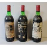 CHÂTEAU DU BARRAIL, 1975, THREE BOTTLES OF VINTAGE BORDEAUX WINE Having red seal caps, bearing label