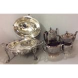 AN EARLY 20TH CENTURY SILVER PLATED REVOLVING BREAKFAST DISH Having a dome shaped top and raised