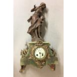 A LATE 19TH CENTURY FRENCH TABLE CLOCK With sculpture figure of a water carrier, a green onyx base