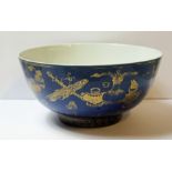 A CHINESE KANGXI PERIOD POWDER BLUE AND GILT BOWL Decorated with floral vases and various
