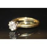 AN 18CT GOLD AND DIAMOND SOLITAIRE RING The single round cut diamond set on a eight prong clasp.