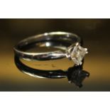 AN 18ct WHITE GOLD AND DIAMOND SOLITAIRE RING, having a single princess cut diamond held in a