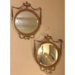 A PAIR OF EDWARDIAN ADAMS REVIVAL CIRCULAR BEVELLED PLATE MIRRORS, crested with urns and swags 66