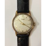 TISSOT, A GENT'S 9CT GOLD WRISTWATCH The silvered dial with crosshatch decoration, yellow metal