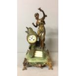 A FRENCH ART NOUVEAU GILT METAL MOUNTED AND FIGURAL CLOCK The figure of Flora offering to the sun,