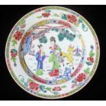 A CHINESE YONGZHENG PERIOD ROSE VERTE PORCELAIN PLATE Hand painted with figures in a garden with a