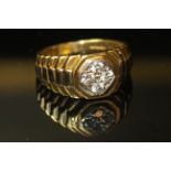 AN 18CT GOLD AND DIAMOND FOUR STONE RING The four round cut diamonds set on an octagonal bezel,