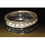 AN 18CT WHITE GOLD AND DIAMOND HALF ETERNITY RING Set with nine round cut diamonds. Size Q