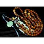 A BEAUTIFUL CHINESE 19TH CENTURY COURT NECKLACE, Of 108 carnelian beads with other fitments in glass