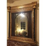 A VICTORIAN DESIGN GILT FRAMED OVERMANTEL MIRROR, inset with lattice work panels flanked by barley