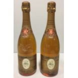 TWO BOTTLES OF LOUIS ROEDERER 1973 CRISTAL CHAMPAGNE With gold label and sealed caps