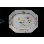 A LARGE QIANLONG ARMORIAL 'FAMILLE-ROSE' MEAT DISH Decorated with sprays of peony and other