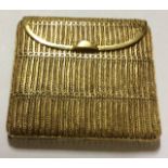 A VINTAGE SILVER GILT FILIGREE CIGARETTE CASE The fine wire work forming vertical sections and