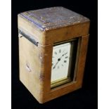 A 20th CENTURY GILT BRASS CARRIAGE CLOCK AND LEATHER TRAVEL CASE Having four bevelled glass panels